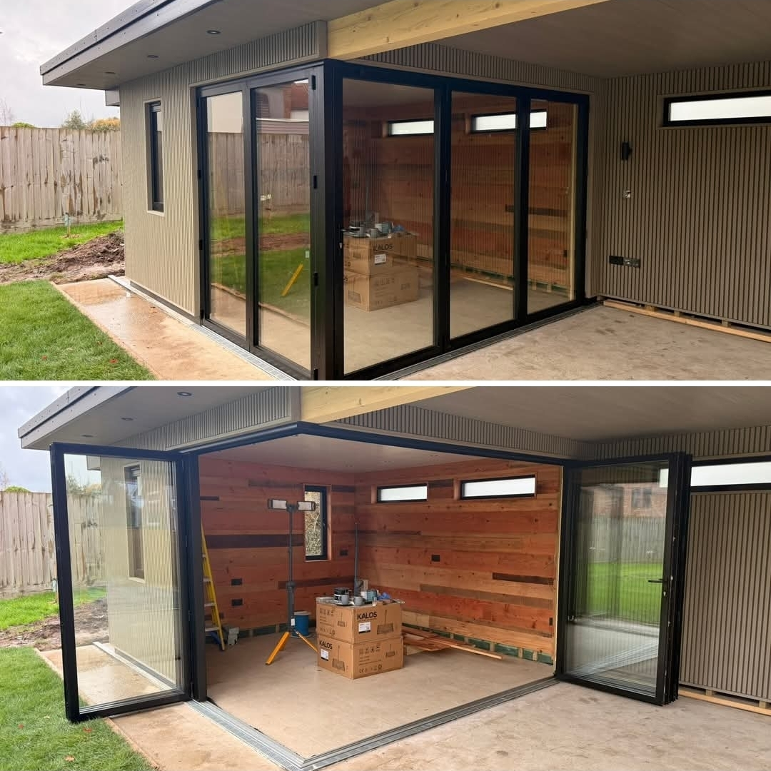Garden room with full-height bifold doors and cedar interior cladding